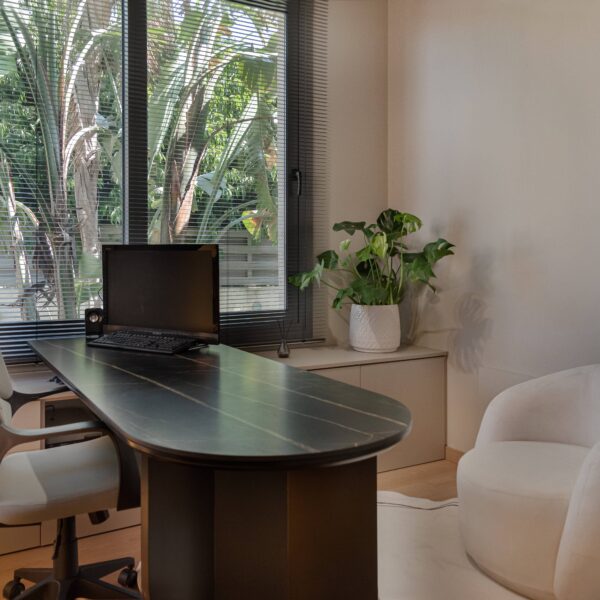 Luxury home office design in Nicosia with modern minimalist style by Migliore Interiors Custom built-in cabinetry and shelving in a contemporary Cyprus office interior Elegant office desk and ergonomic seating in Migliore Nicosia No. 14 project Warm ambient lighting and hidden cove lights in a luxury Nicosia office space Refined material palette with wood tones and matte finishes in a modern home office Minimalist office layout with natural light and bespoke storage solutions in Nicosia Luxury Cyprus interior design featuring functional workspace and elegant details Contemporary home office retreat with calm, refined atmosphere by Migliore Interiors