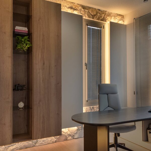 Luxury home office design in Nicosia with modern minimalist style by Migliore Interiors Custom built-in cabinetry and shelving in a contemporary Cyprus office interior Elegant office desk and ergonomic seating in Migliore Nicosia No. 14 project Warm ambient lighting and hidden cove lights in a luxury Nicosia office space Refined material palette with wood tones and matte finishes in a modern home office Minimalist office layout with natural light and bespoke storage solutions in Nicosia Luxury Cyprus interior design featuring functional workspace and elegant details Contemporary home office retreat with calm, refined atmosphere by Migliore Interiors