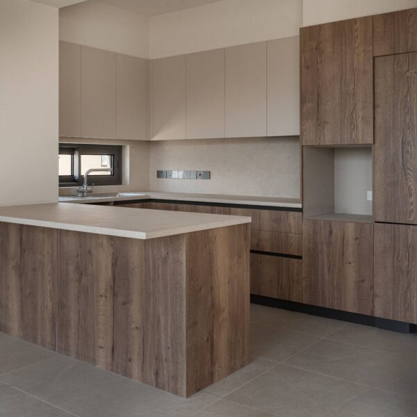 Modern open-plan living area in Migliore Nicosia No. 18 – Flat B Contemporary kitchen design with neutral tones in Nicosia flat Spacious dining area featuring minimalist furniture layout Cozy bedroom with high-quality materials and functional design Stylish bathroom with modern fixtures and clean lines