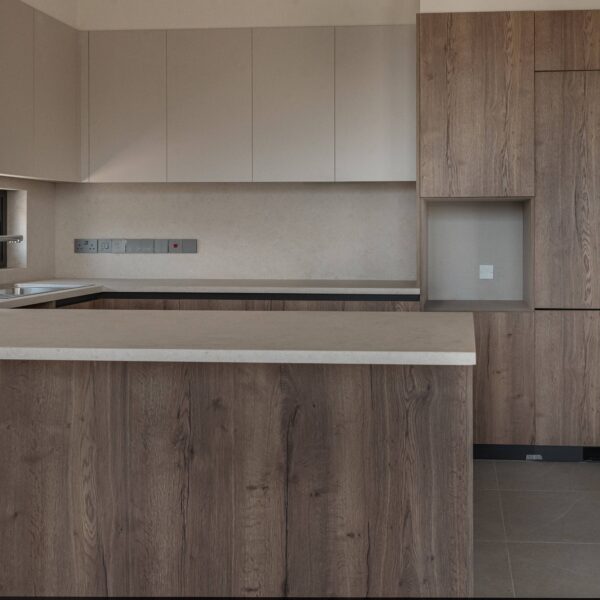 Modern open-plan living area in Migliore Nicosia No. 18 – Flat B Contemporary kitchen design with neutral tones in Nicosia flat Spacious dining area featuring minimalist furniture layout Cozy bedroom with high-quality materials and functional design Stylish bathroom with modern fixtures and clean lines
