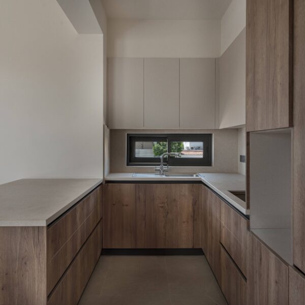 Modern open-plan living area in Migliore Nicosia No. 18 – Flat B Contemporary kitchen design with neutral tones in Nicosia flat Spacious dining area featuring minimalist furniture layout Cozy bedroom with high-quality materials and functional design Stylish bathroom with modern fixtures and clean lines