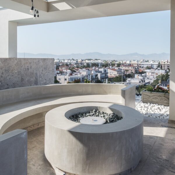 “After – Rooftop garden with natural stone paving and seating area” “After – Timber pergola shading outdoor lounge on roof terrace” “After – Built-in planter beds with greenery in rooftop design” “After – Evening rooftop garden with ambient outdoor lighting” “After – Detail of stone paving and glass railing overlooking Nicosia